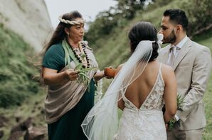 Officiant Guiding Couple Through Traditional Hawaiian Wedding Ceremony