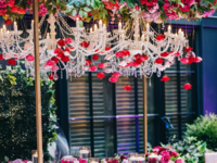 Crystal chandeliers decorated with red roses