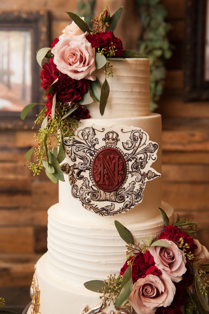 Brooklyn and Caleb featured three cakes at the reception. The largest was vanilla bean cake with buttercream icing and was adorned with a replica of their wedding crest with the bordeaux wax monogram seal mimicking the invitations and programs.