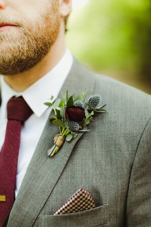 Groom's Gray Suit with Burgundy Accessories and Ranunculus and Thistle Boutonniere