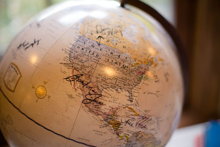 Their globe guest book followed every milestone of their relationship and beyond. “We met in undergraduate school at the University of Pittsburgh, got engaged in Ireland and have settled in North Carolina,” Emily says. “Chris is in the Army, so our future plans are still up in the air. But we liked the idea behind the globe because we would go to the ends of the earth for each other.” Their guests became a part of their story as they signed a name or piece of advice across the globe. Those who wanted to leave a longer message were welcomed to write away in an old dictionary.