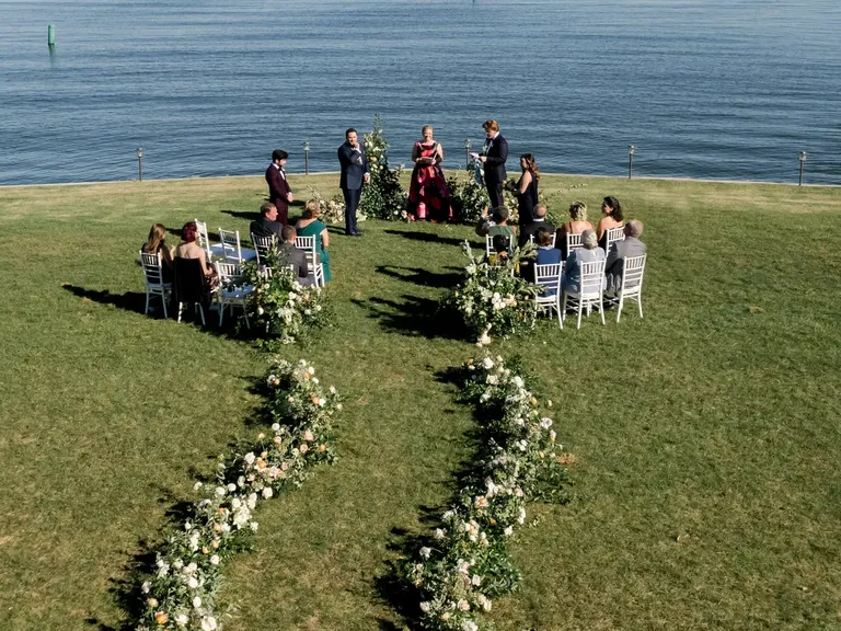 Waterfront Wedding Ceremony with Curved Floral Aisle