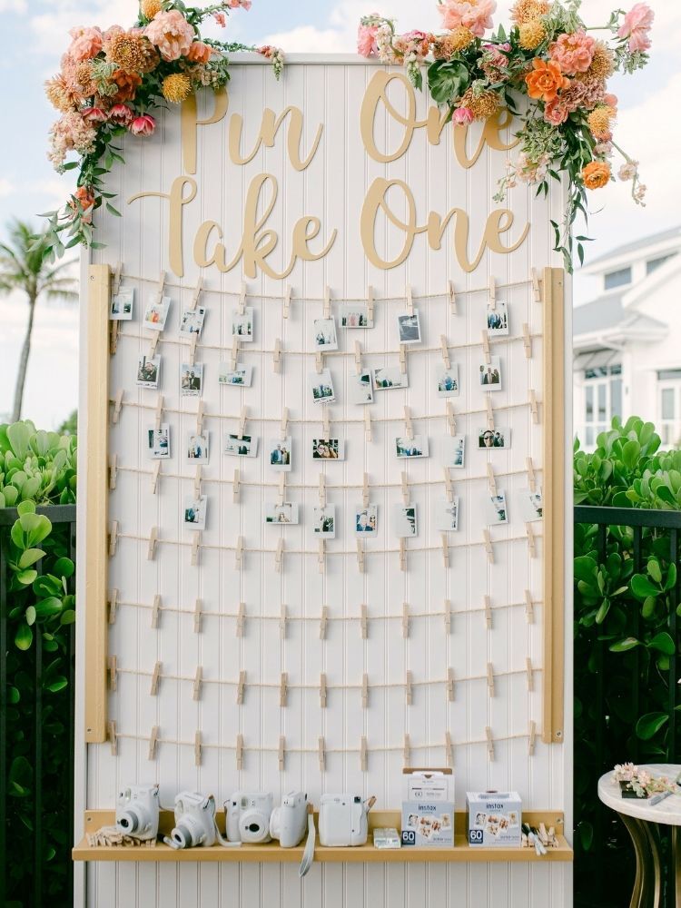 polaroid picture display at beach wedding