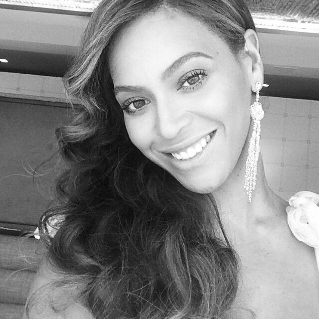 Beyonce smiles in a black-and-white selfie. 