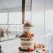 Colorful Naked Cake With Orange Blossoms and Fruit