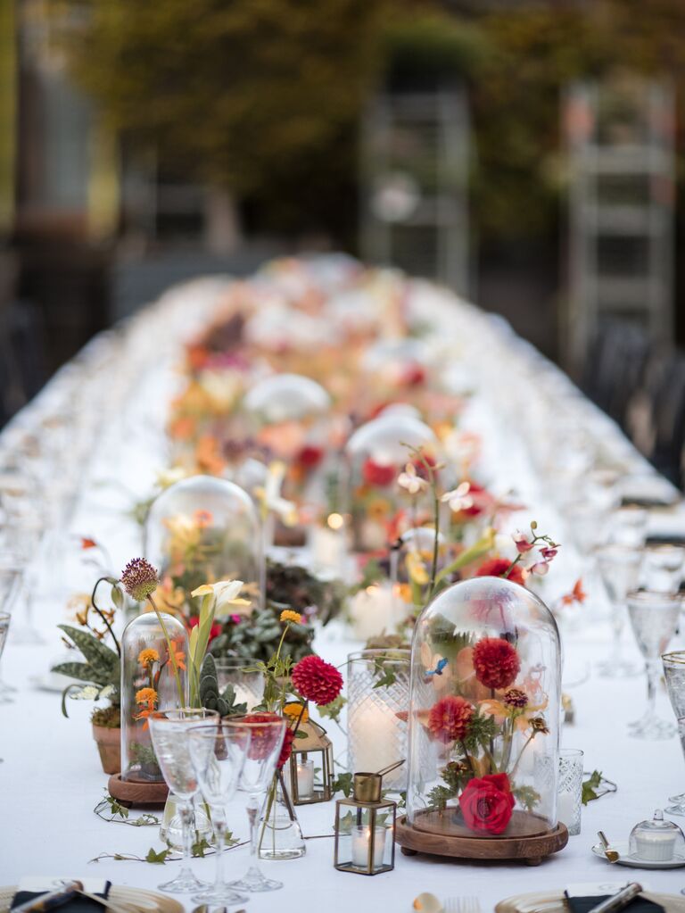 unique wedding centerpiece idea with bell jars over flowers