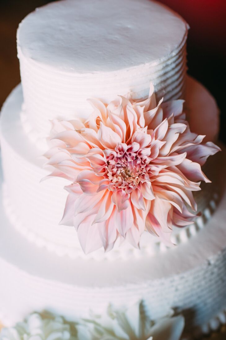 Molly and Ryan opted for a simple white wedding cake that was flavored with raspberry filling and cream cheese frosting. They also had rice krispies and raspberry chocolate truffles for dessert.