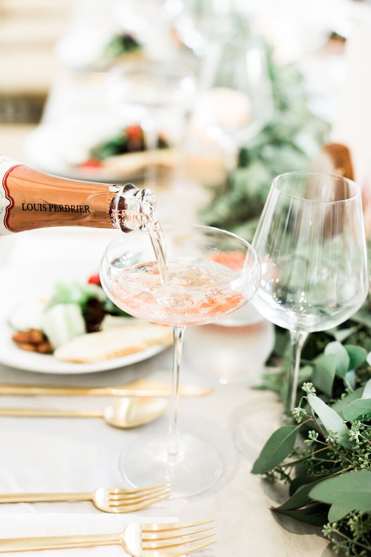 In keeping with the palette of peach, ivory, green and gold, Bonnie and Jason served rose wine at their reception at Cheekwood Botanical Gardens in Nashville, Tennessee. Gold flatware added a subtle metallic gleam.