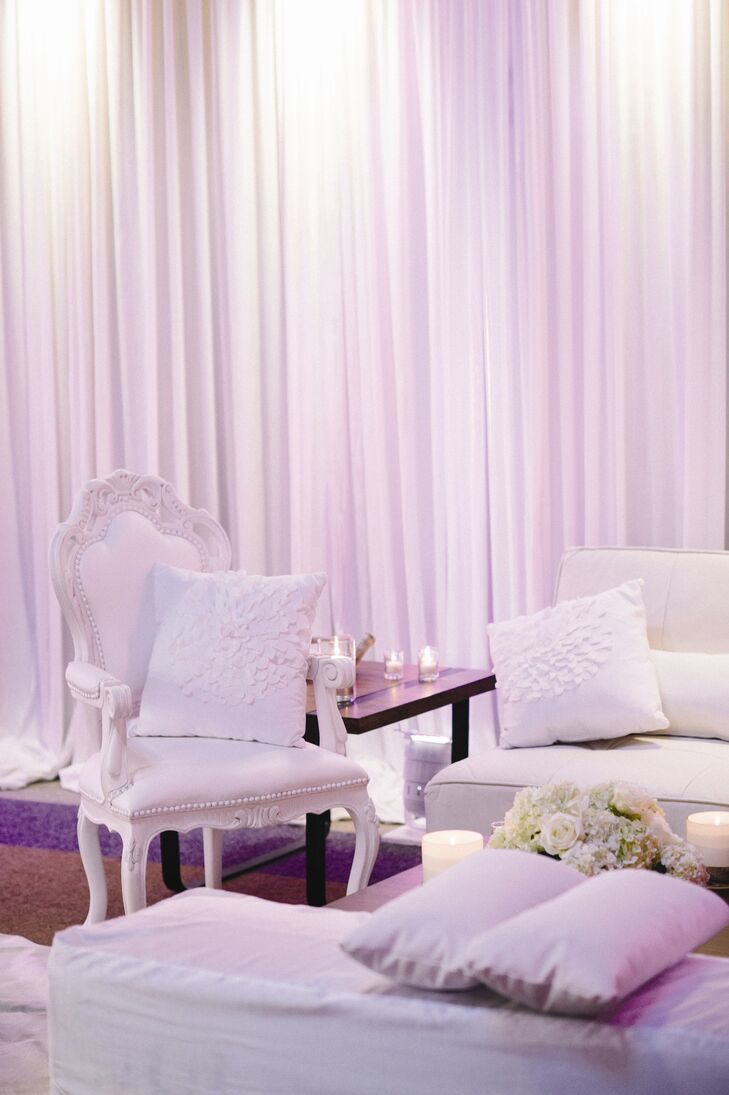 White armchairs and couches added a modern, elegant vibe to the lounge area.