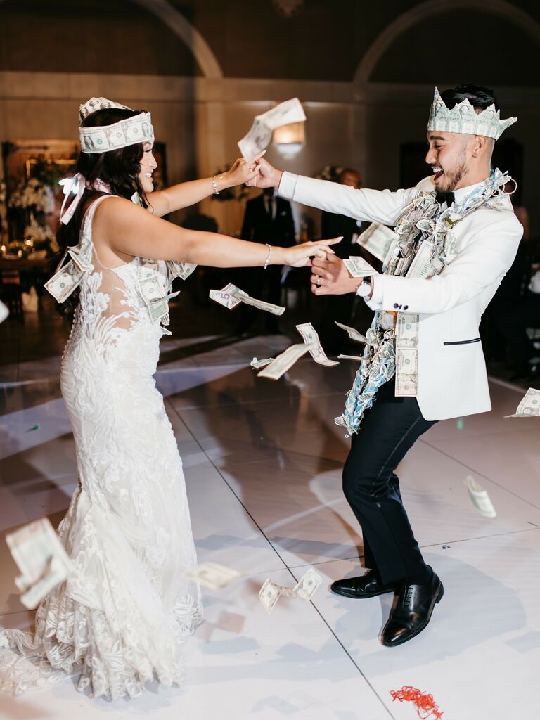 Bride and groom doing a money dance. 