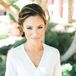 Bree wore an embroidered ivory dressing robe as she and her bridesmaids were prepped with hair and makeup artists from Oceanside's Big Day Hair and Makeup. Her hair—a low, loose bun twisted together at the nape of her neck—reflected the day's polished, romantic feel.