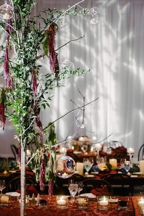 Tea Lights in Glass Bulbs Hanging from Branches