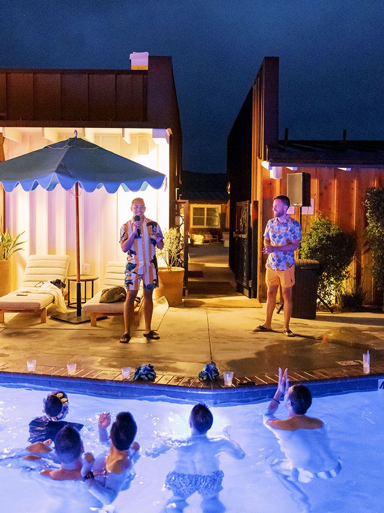couple giving speech at welcome party