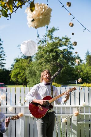 Groom Playing Music During Cocktail Hour