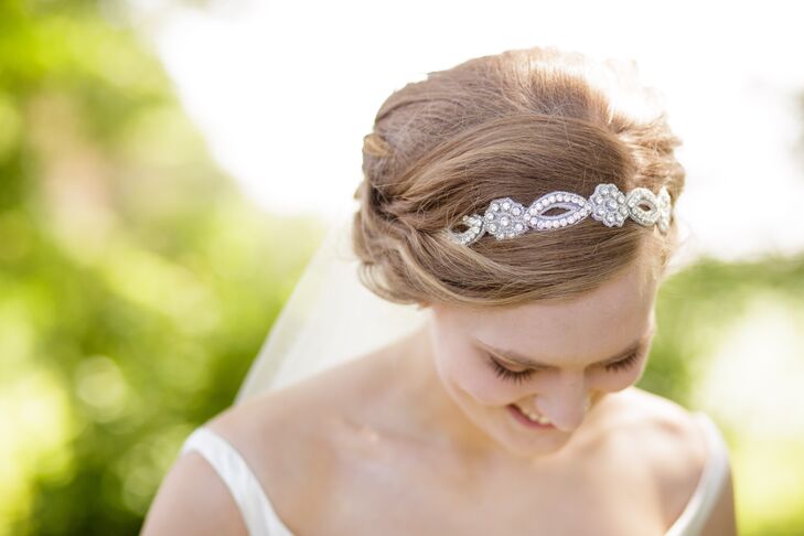 Woven into Bridget's updo hairstyle was an elegant floral headband, which had a beaded crystal pattern throughout.