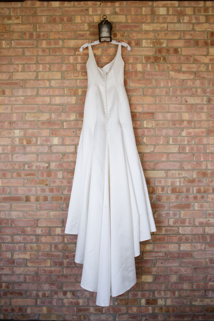 "The dress I found hugged by curves, but kept me looking classy," Bridget says. "It had a beautiful train that swept along behind me. My dress had no beading or decoration on it, which allowed the gorgeous heavy ivory satin it was made out of to shine."