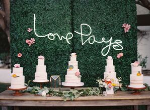 Bohemian Cake Table with Flower Wall and Neon Sign