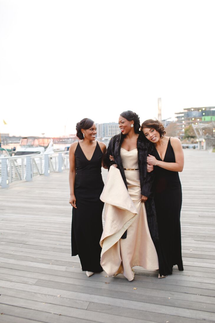 Bride in Champagne Gown with Fur Stole and Bridesmaids in Black Gowns