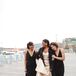 Bride in Champagne Gown with Fur Stole and Bridesmaids in Black Gowns