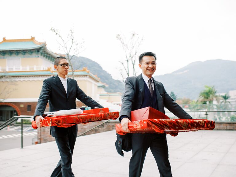 Six gifts being carried into Chinese wedding ceremony