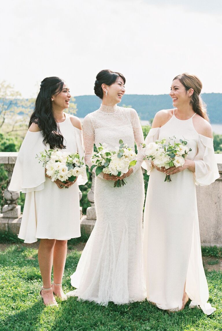 Bride with two bridesmaids in white dresses