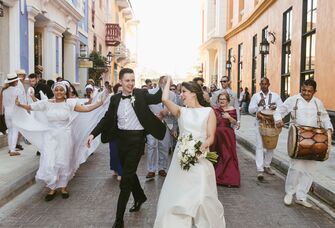Bride and groom dance down the streets of Cartagena, Colombia.