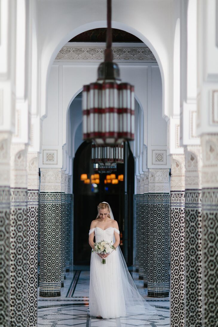 “For my bridal dress, it was important to me that the style fit with the overall wedding aesthetic,” Lauren says. Monique Lhuillier’s Marcella dress checked all the boxes, with its ethereal layers of tulle, silver and white sequin-studded under layer and off-the-shoulder silhouette. “I’m all about shoulders, so with the help of the alterations expert at Ultimate Bride, we amended the straps to be draped around my arms. Game changer—we also made them detachable, which allowed me to get down on the dance floor later that evening,” Lauren says.