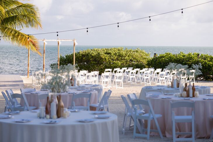 Each table was set with white or light pink linens and metallic centerpieces. “Damien and I wanted something that would be timeless,” says Kristen.