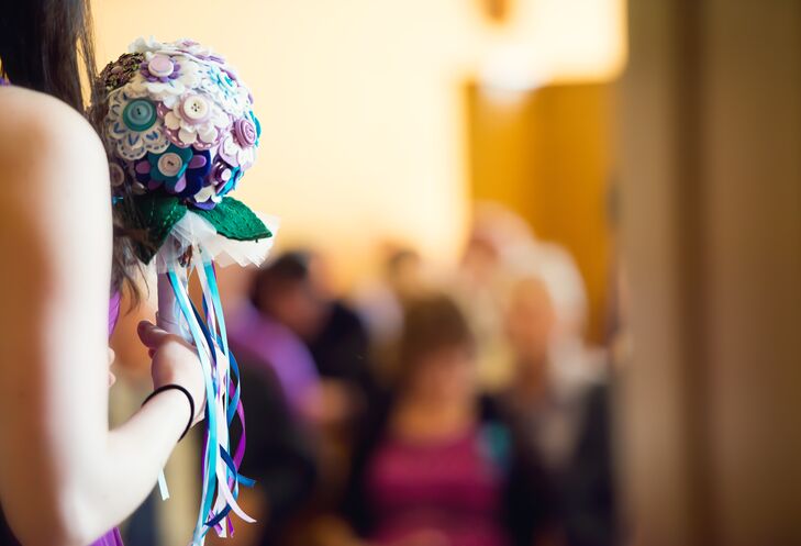 Each bridesmaid handmade her own felt flower bouquet; adding her own unique style to the bouquet. Long blue, purple and white ribbons were strung from the bottom for an added whimsical touch.