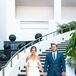 Echoing the laid-back and organic atmosphere of Flora Farm in San Jose del Cabo, Mexico, Taylor donned a boho-chic Sarah Seven dress with a sweetheart neckline and draped sleeves. “It was romantic yet simple, and I knew Cody would love it,” she says. Cody sported a dark blue suit, white button-down, blue and green tie and vintage kicks.