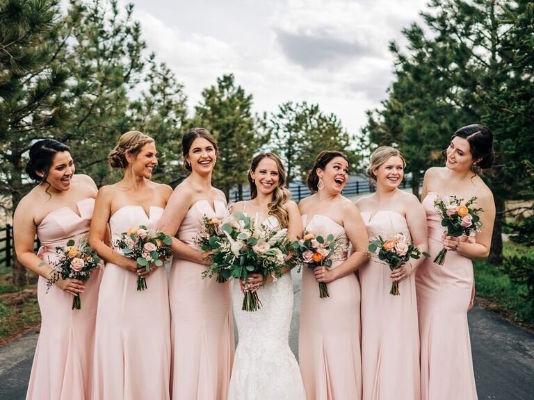 Bride and bridesmaids pose with their hair and makeup done by I Do Beauty Boutique in Colorado. 