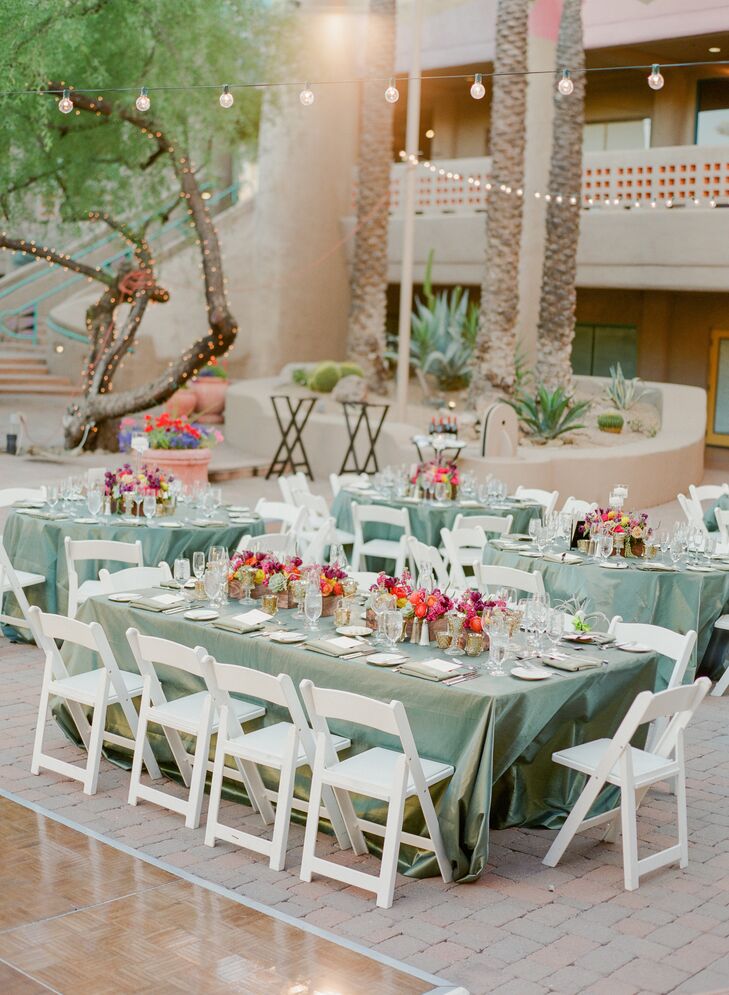 "Since our flowers were bold and colorful, I loved the idea of a neutral green contrasted against all the color we had naturally in our floral pieces for our tables and linens. We chose a shimmer thyme for the tables and a moss green napkin. It looked gorgeous," she says.