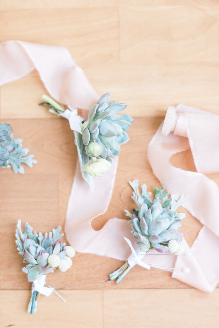 While the bouquet designs were left up to the pros at Isn’t She Lovely Florals, Stephanie and Dallas had a specific vision for the boutonniere: They wanted succulents. Each man in the wedding party wore a small arrangement of succulents, dusty miller and silver brunia on his lapel.