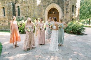 Bridesmaids Outside Church in Floral, Springtime Dresses With Colorful Bouquets