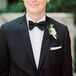 "The groomsmen boutonnieres each included a ranunculus and some silver greenery," says Anne.