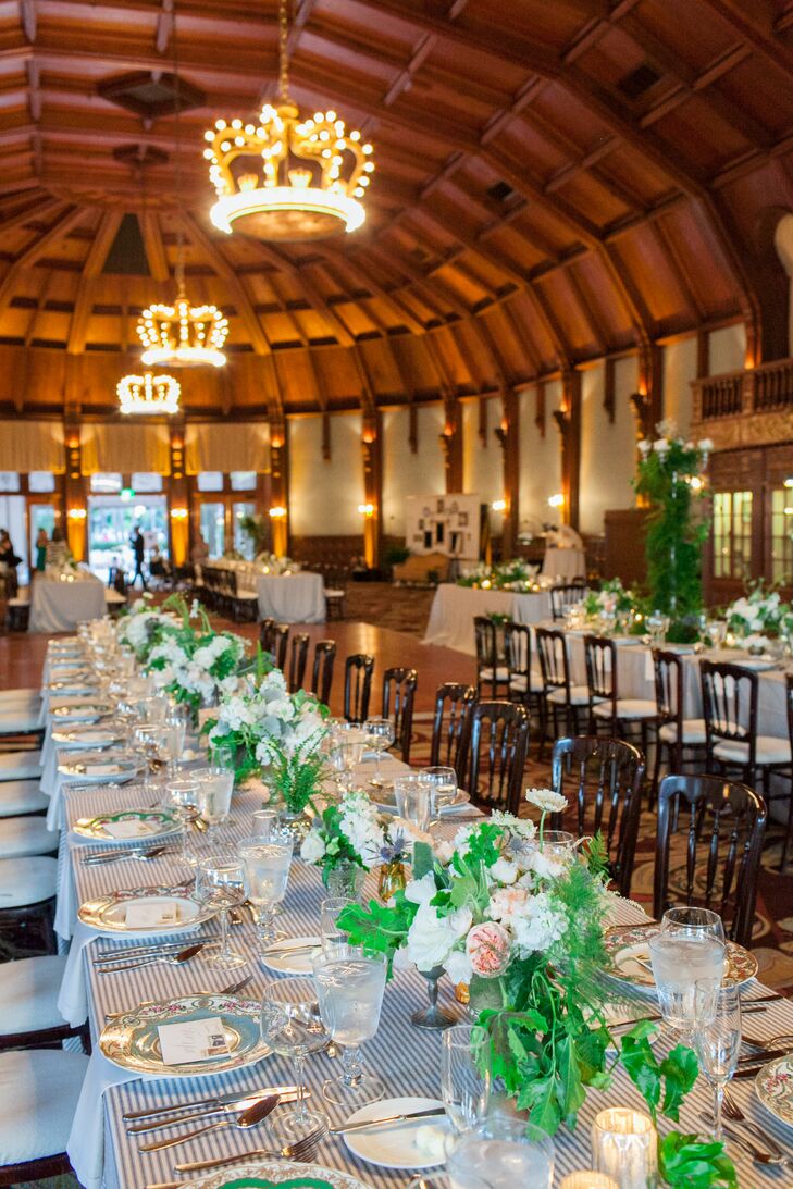 "Our tables were long family style tables, and in the seats where there was not a guest tornfill it, we placed items from a historic figure there to make it look like they had been sitting there," Bayley says. "For example, there was a place card that said “Reserved for Marilyn Monroe” and at the seat there was a perfume bottle and a vintage mirror."