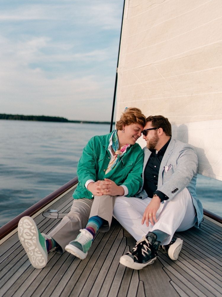 engagement photo with couple on sailboat