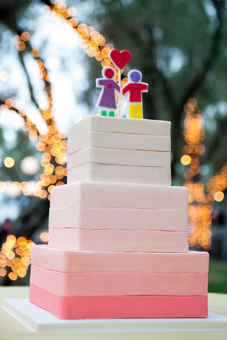 The whimsical cake topper was one of the day’s most meaningful details. The stick boy and girl holding a heart originally appeared on a card Deanna gave Dan while they were dating. Dan then used the same image in his proposal. “We knew that it was really important, and we wanted that to be our cake topper,” Deanna says.