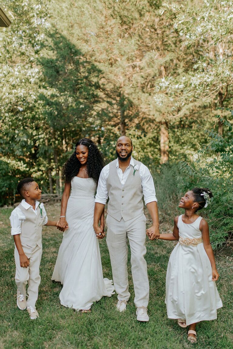Couple with children all dressed in white outfits