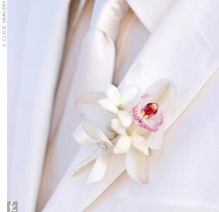 Jeff looked crisp and dapper in a white linen suit, white shirt, and tie by Hugo Boss. His miniature cymbidium orchid and stephanotis boutonniere gave just a hint of color.
