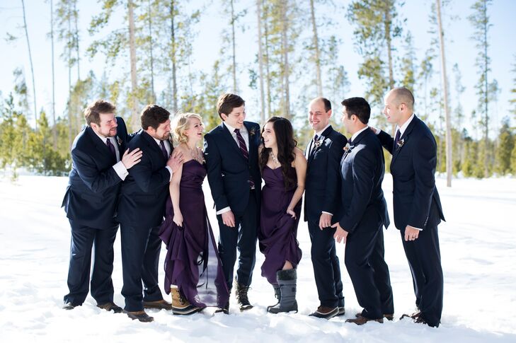 Sean wore a navy Hugo Boss suit and the groomsmen wore matching navy suits and plum ties for a consistent, chic look.