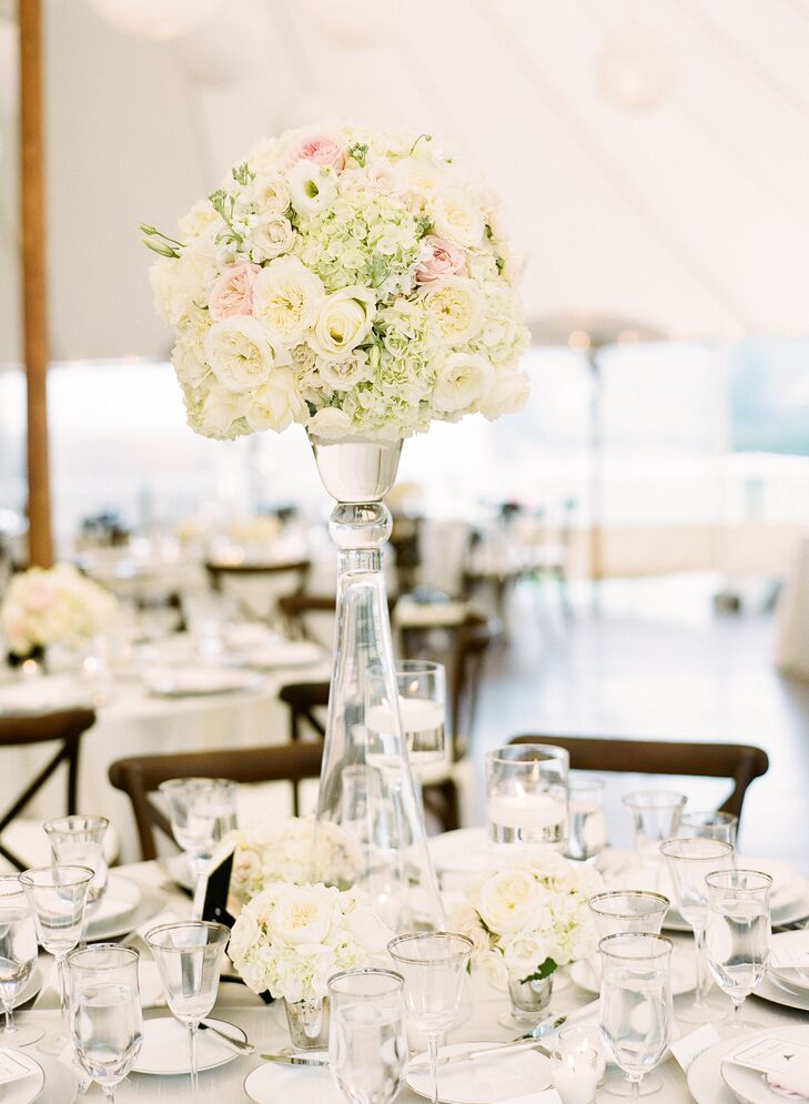 With the help of planner Zoe Ross of ZBR Events and the talented florists at Flowers on the Vineyard, the couple made the venue their own with a color palette of soft champagne, ivory and blush hues and lush, varied arrangements of roses and hydrangeas that gave the reception tent texture and dimension.