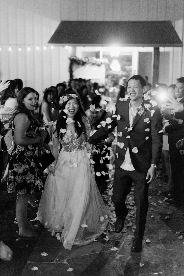 The newlyweds ended the night walking through a shower of petals, honoring the day's theme, "Love in bloom."