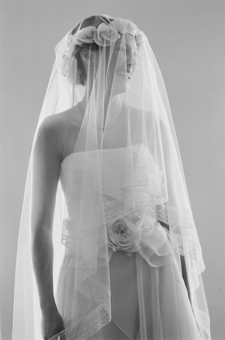Since Tessa loves long, dramatic veils, she knew she had to have one. She thought her English tulle and French lace veil would be too much with the Habutai silk rose crown and her Dolce & Gabbana dress, but when she put it all on together, she was in love.