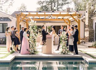 With just 30 days of planning, Caroline and Gene pulled together an elegant, intimate backyard wedding with a neutral color palette of dusty rose and 