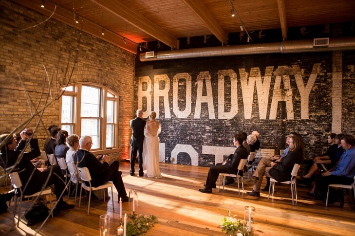 The intimate ceremony took place on the second floor of the art gallery. Brick walls and natural sunlight added warmth to the room.