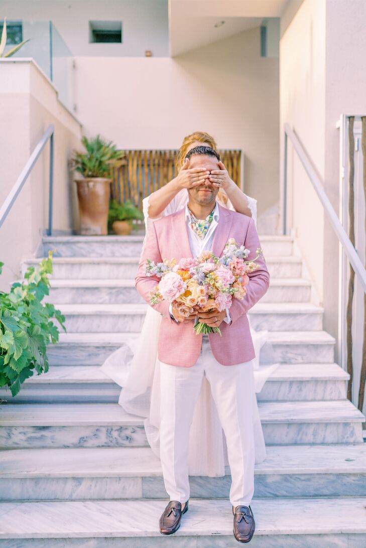 First Look With Groom in Pink Suit at Ekies All Senses Resort in Greece