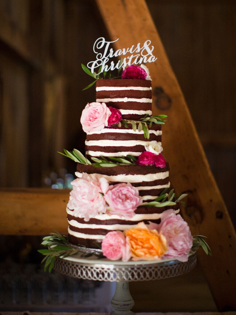 four tier red velvet  naked wedding cake decorated with blush and bright pink peonies