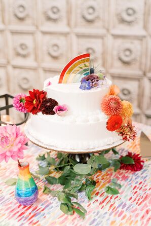 Two-Tier White Wedding Cake With Rainbow Topper
