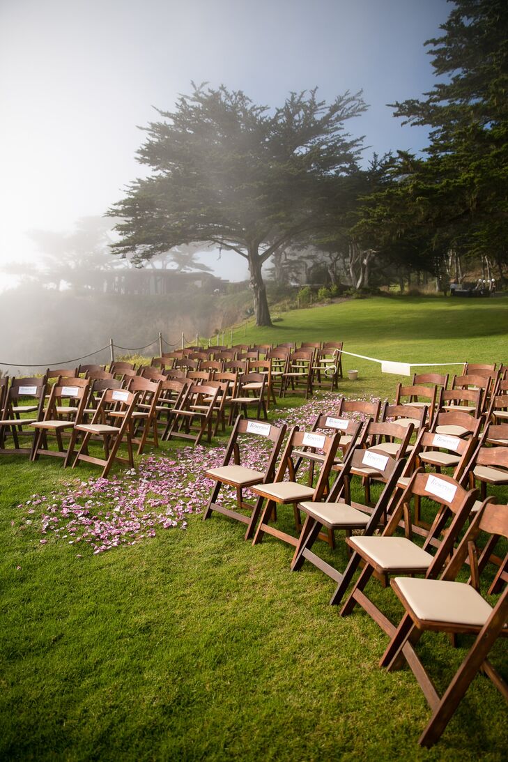 Guests sat on dark wooden folding chairs during the ceremony.